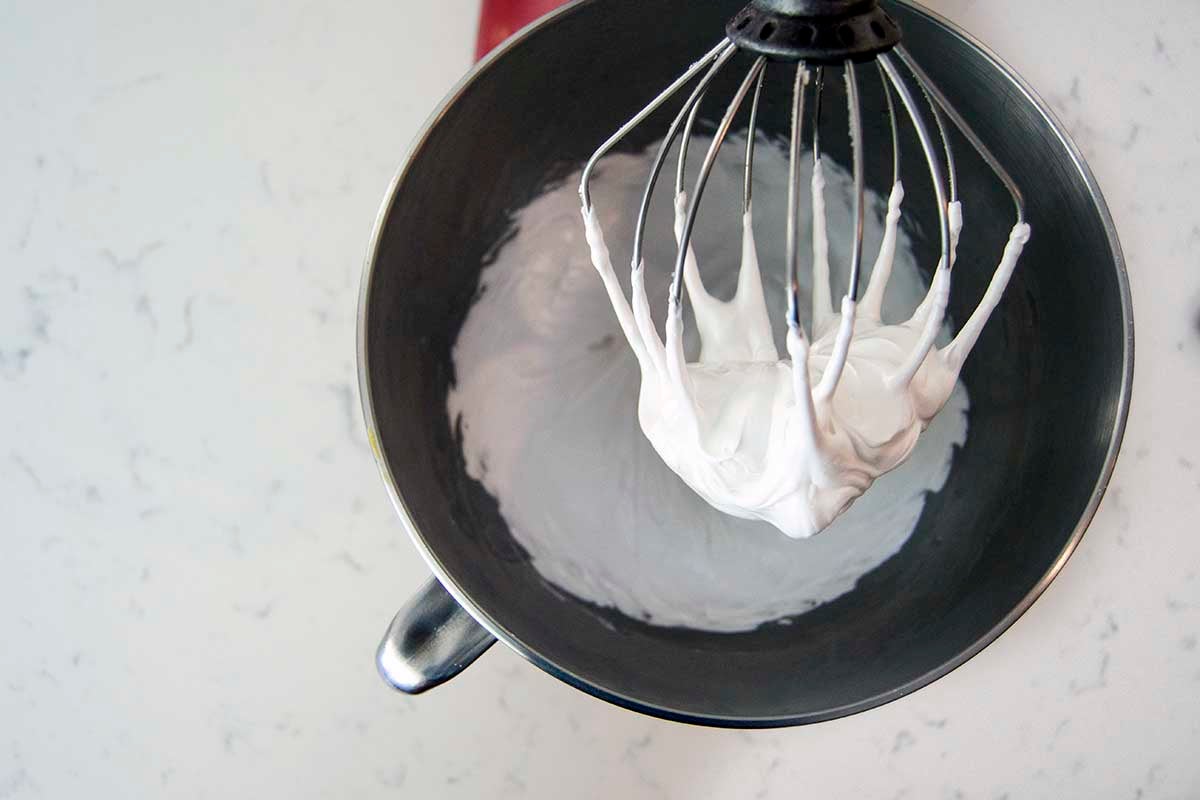 Stand mixer with bowl of whipped aquafaba